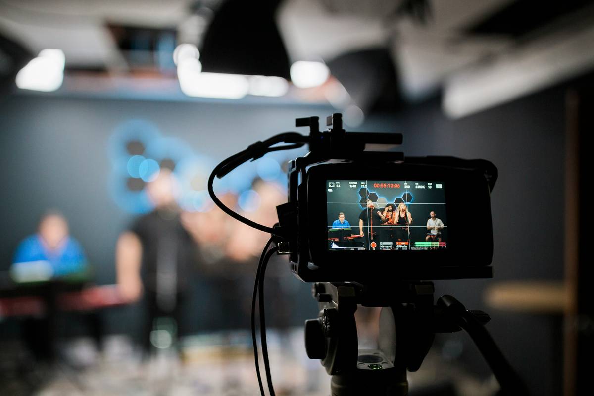 Stream setup showing proper three-point video equipment light how to stream arrangement with softboxes and ring light